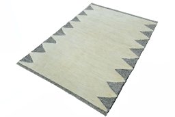 Corner detail of New Persian Gabbeh rug showing border pattern and Wool pile