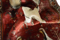Corner detail of 2000s Persian Gabbeh rug showing border pattern and Wool pile