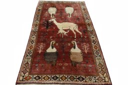 Surface texture of 2000s Persian Gabbeh rug with natural Wool and intricate pattern