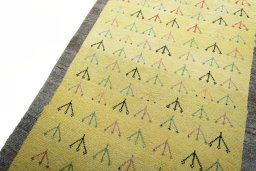 Backside of handmade 2000s Persian Gabbeh rug showing knot structure and weave density