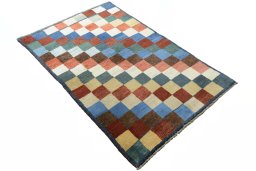 Close-up detail of 2000s Persian Gabbeh rug from Iran / Persia showing Wool weave