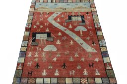 Surface texture of 2000s Persian Gabbeh rug with natural Wool and intricate pattern