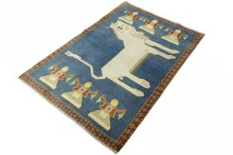 Corner detail of 2000s Persian Gabbeh rug showing border pattern and Wool pile
