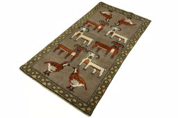 Corner detail of 2000s Persian Gabbeh rug showing border pattern and Wool pile