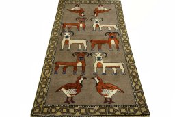 Surface texture of 2000s Persian Gabbeh rug with natural Wool and intricate pattern