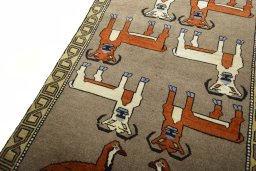 Backside of handmade 2000s Persian Gabbeh rug showing knot structure and weave density