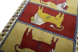 Backside of handmade 2000s Persian Gabbeh rug showing knot structure and weave density