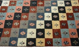 Close-up detail of 2000s Persian Gabbeh rug from Iran / Persia showing Wool weave