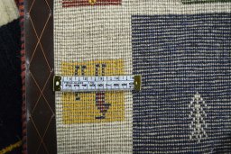 Corner detail of New Persian Gabbeh rug showing border pattern and Wool pile