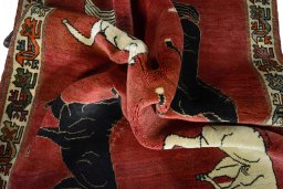 Corner detail of 2000s Persian Gabbeh rug showing border pattern and Wool pile