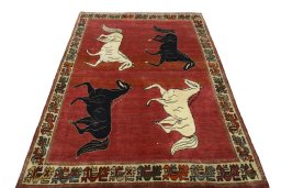 Surface texture of 2000s Persian Gabbeh rug with natural Wool and intricate pattern