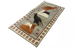 Corner detail of 2000s Persian Gabbeh rug showing border pattern and Wool pile