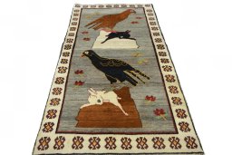 Surface texture of 2000s Persian Gabbeh rug with natural Wool and intricate pattern