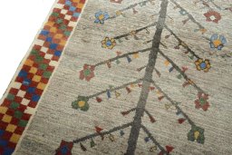 Backside of handmade New Persian Gabbeh rug showing knot structure and weave density