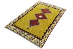 Corner detail of 2000s Persian Gabbeh rug showing border pattern and Wool pile