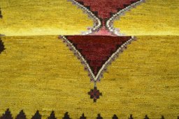 Full view of 2000s Persian Gabbeh rug from Iran / Persia, 152 × 98 cm in Yellow tones
