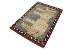 Corner detail of 2000s Persian Gabbeh rug showing border pattern and Wool pile
