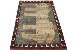 Surface texture of 2000s Persian Gabbeh rug with natural Wool and intricate pattern
