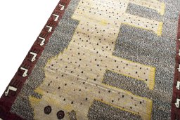 Backside of handmade 2000s Persian Gabbeh rug showing knot structure and weave density