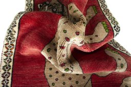 Corner detail of 2000s Persian Gabbeh rug showing border pattern and Wool pile
