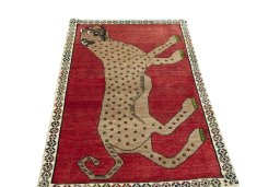 Surface texture of 2000s Persian Gabbeh rug with natural Wool and intricate pattern