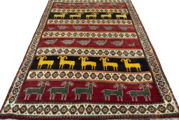 Surface texture of 2000s Persian Gabbeh rug with natural Wool and intricate pattern