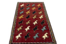 Surface texture of 2000s Persian Gabbeh rug with natural Wool and intricate pattern