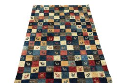 Surface texture of 2000s Persian Gabbeh rug with natural Wool and intricate pattern