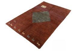 Corner detail of 2000s Persian Gabbeh rug showing border pattern and Wool pile