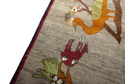 Backside of handmade 2000s Persian Gabbeh rug showing knot structure and weave density