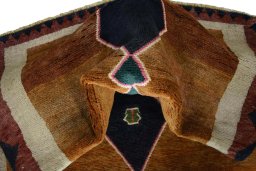 Corner detail of 2000s Persian Gabbeh rug showing border pattern and Wool pile