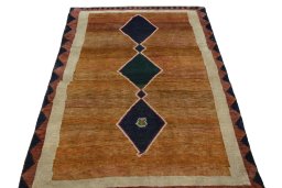 Surface texture of 2000s Persian Gabbeh rug with natural Wool and intricate pattern
