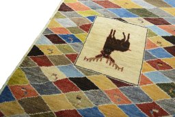 Backside of handmade 2000s Persian Gabbeh rug showing knot structure and weave density