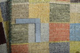 Close-up detail of 2000s Persian Gabbeh rug from Iran / Persia showing Wool weave