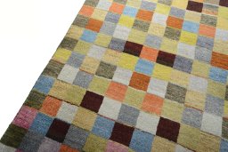 Backside of handmade 2000s Persian Gabbeh rug showing knot structure and weave density