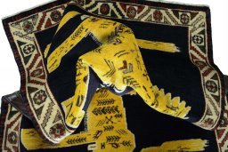 Corner detail of 2000s Persian Gabbeh rug showing border pattern and Wool pile