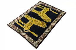 Corner detail of 2000s Persian Gabbeh rug showing border pattern and Wool pile