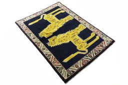 Close-up detail of 2000s Persian Gabbeh rug from Iran / Persia showing Wool weave