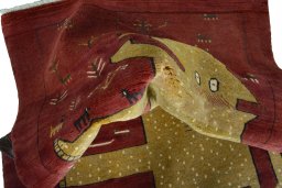 Corner detail of 2000s Persian Gabbeh rug showing border pattern and Wool pile