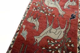 Backside of handmade 2000s Persian Gabbeh rug showing knot structure and weave density