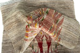 Corner detail of New Persian Gabbeh rug showing border pattern and Wool pile