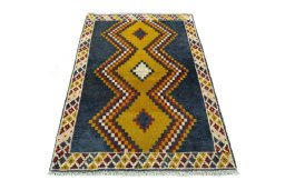 Surface texture of 2000s Persian Gabbeh rug with natural Wool and intricate pattern