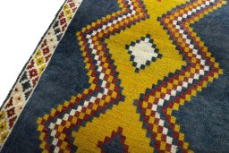 Backside of handmade 2000s Persian Gabbeh rug showing knot structure and weave density