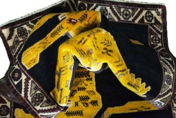 Corner detail of 2000s Persian Gabbeh rug showing border pattern and Wool pile