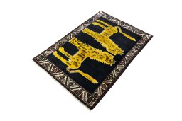 Corner detail of 2000s Persian Gabbeh rug showing border pattern and Wool pile
