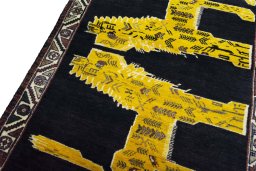Backside of handmade 2000s Persian Gabbeh rug showing knot structure and weave density