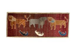 Full view of 2000s Persian Gabbeh rug from Iran / Persia, 217 × 87 cm in Red tones