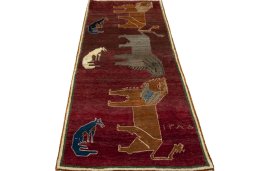 Surface texture of 2000s Persian Gabbeh rug with natural Wool and intricate pattern