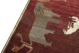 Backside of handmade 2000s Persian Gabbeh rug showing knot structure and weave density