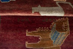 Full view of 2000s Persian Gabbeh rug from Iran / Persia, 217 × 87 cm in Red tones